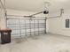 Spacious two-car garage with automatic door opener and concrete flooring provides ample storage at 6203 Sw 93Rd Loop, Ocala, FL 34476