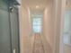 Bright hallway with tile flooring and a view to the living room at 6203 Sw 93Rd Loop, Ocala, FL 34476