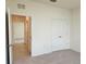 Hallway with access to a bedroom and closet, showcasing the home's design at 6203 Sw 93Rd Loop, Ocala, FL 34476