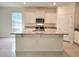 Open kitchen with granite countertops, stainless steel appliances, and ample cabinet space for storage at 6203 Sw 93Rd Loop, Ocala, FL 34476