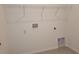 Utility room with shelving and a hookup for a washer and dryer on tile floor at 6203 Sw 93Rd Loop, Ocala, FL 34476
