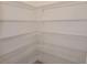 Walk-in pantry with white wire shelving at 6203 Sw 93Rd Loop, Ocala, FL 34476