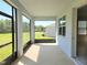 Screened patio with green backyard views that provide outdoor living space at 6203 Sw 93Rd Loop, Ocala, FL 34476