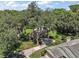 Picture of expansive lot featuring a well maintained lawn, surrounded by mature trees at 621 High Point Dr, Mount Dora, FL 32757