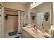 Bathroom featuring a vanity with a pink sink and a bathtub with a shower at 621 High Point Dr, Mount Dora, FL 32757