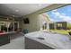 Hot tub on a screened-in patio, perfect for relaxation, with open views at 6243 Danielson Loop, The Villages, FL 32163