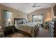 Spacious main bedroom with a large bed, matching nightstands, and plenty of natural light from the windows at 6243 Danielson Loop, The Villages, FL 32163