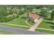 A beautifully landscaped property featuring mature trees and a long driveway leading to the home at 7629 Lake Angelina Dr, Mount Dora, FL 32757