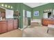 Expansive bathroom featuring dual vanities, a glass shower, and a large soaking tub at 7629 Lake Angelina Dr, Mount Dora, FL 32757