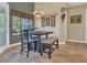 Cozy breakfast nook with tile flooring and natural light from the window at 7629 Lake Angelina Dr, Mount Dora, FL 32757