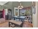 Inviting dining room with dark wood table, neutral bench, and elegant chandelier at 7629 Lake Angelina Dr, Mount Dora, FL 32757