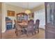 Formal dining room with elegant chandelier and hardwood floors at 7629 Lake Angelina Dr, Mount Dora, FL 32757