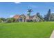 Charming single Gathering home with stone accents and lush landscaping at 7629 Lake Angelina Dr, Mount Dora, FL 32757