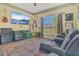 Relaxing living room with neutral color scheme, plush seating, and bright window at 7629 Lake Angelina Dr, Mount Dora, FL 32757