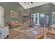 Spacious living room with high ceilings and comfortable leather furniture at 7629 Lake Angelina Dr, Mount Dora, FL 32757