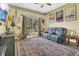 Relaxing living room with neutral color scheme, plush seating, and bright window at 7629 Lake Angelina Dr, Mount Dora, FL 32757