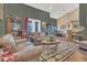 Spacious living room with bar and comfortable leather furniture at 7629 Lake Angelina Dr, Mount Dora, FL 32757