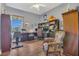 Comfortable office space with hardwood floors, a window, and ample storage at 7629 Lake Angelina Dr, Mount Dora, FL 32757