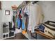 Walk-in closet featuring metal shelving, hanging storage, and dark hardwood floors at 7629 Lake Angelina Dr, Mount Dora, FL 32757