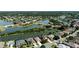 Beautiful aerial view of a lakeside residential community with lush landscaping and homes surrounding a large lake at 7873 Crosswinds Way, Mount Dora, FL 32757
