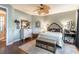 Spacious primary bedroom with hardwood floors, a ceiling fan, and neutral color palette at 7873 Crosswinds Way, Mount Dora, FL 32757