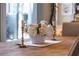 Elegant dining table setting features a floral centerpiece and decorative candles at 7873 Crosswinds Way, Mount Dora, FL 32757