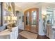 Inviting foyer with stylish decor, double doors, and lots of natural light at 7873 Crosswinds Way, Mount Dora, FL 32757