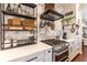 Well-equipped kitchen with quartz countertop, an island, and stainless steel appliances at 7873 Crosswinds Way, Mount Dora, FL 32757