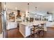 Beautiful kitchen features an island, white cabinets, and stainless steel appliances at 7873 Crosswinds Way, Mount Dora, FL 32757