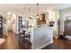 Spacious kitchen with an island, wooden accents and stainless steel appliances at 7873 Crosswinds Way, Mount Dora, FL 32757