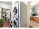 Conveniently located laundry area with stackable washer/dryer that is located near the bathroom at 7873 Crosswinds Way, Mount Dora, FL 32757