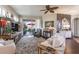 Cozy living room with plush seating, decorative rug, and sliding doors to the outdoor patio at 7873 Crosswinds Way, Mount Dora, FL 32757