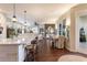 Spacious open concept with a kitchen island, dining area, and a comfortable living room at 7873 Crosswinds Way, Mount Dora, FL 32757