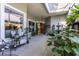 Inviting screened patio with a fountain, plants and ample room for seating at 7873 Crosswinds Way, Mount Dora, FL 32757