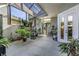 Inviting screened patio with lots of plants, fountain and ample room for seating at 7873 Crosswinds Way, Mount Dora, FL 32757