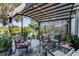 Outdoor patio features comfortable seating area, stylish decor, and scenic waterfront view at 7873 Crosswinds Way, Mount Dora, FL 32757