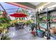 A screened patio features outdoor seating and decor, perfect for enjoying outdoor scenery while being protected from pests at 7873 Crosswinds Way, Mount Dora, FL 32757