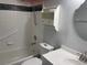 Bathroom featuring an updated cabinet, lighting, framed mirror, tile accents, and hand held shower at 825 Mary Frank Ct, Mount Dora, FL 32757