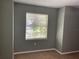 View of bedroom showcasing a plush carpet, neutral paint color, and a window with natural light at 825 Mary Frank Ct, Mount Dora, FL 32757