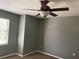 View of bedroom showcasing a ceiling fan, neutral paint color, plush carpet and natural light at 825 Mary Frank Ct, Mount Dora, FL 32757
