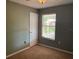 View of bedroom showcasing a ceiling fan, plush carpet, and a window with natural light at 825 Mary Frank Ct, Mount Dora, FL 32757