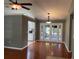 Dining room featuring hardwood floors, stylish lighting, and a sliding door to the outside at 825 Mary Frank Ct, Mount Dora, FL 32757