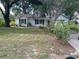 Charming single-story home features a classic design and mature trees in a lush front yard at 825 Mary Frank Ct, Mount Dora, FL 32757