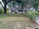 Charming single-story home features a classic design and mature trees in a lush front yard at 825 Mary Frank Ct, Mount Dora, FL 32757