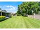 Large backyard with lush, green grass at 8527 Firestone Cir, Clermont, FL 34711