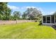 Well-manicured backyard with privacy wall at 8527 Firestone Cir, Clermont, FL 34711