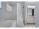 Bathroom featuring a tub shower combo and framed glass door, a perfect place to unwind at 8527 Firestone Cir, Clermont, FL 34711