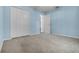 Bedroom with closet doors and light blue walls at 8527 Firestone Cir, Clermont, FL 34711