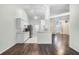 Bright kitchen featuring modern appliances, white cabinetry, and an open layout connecting to the living area at 8527 Firestone Cir, Clermont, FL 34711