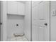 Laundry room with overhead cabinet storage at 8527 Firestone Cir, Clermont, FL 34711
